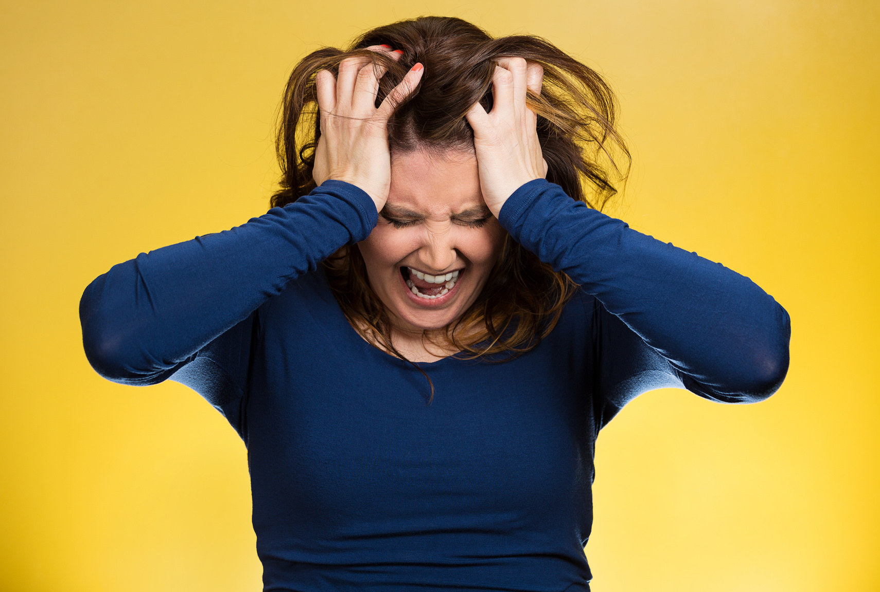 stressed business woman, pulling her hair out, yelling, screaming